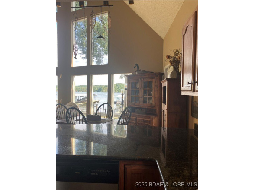 > A wall of windows and vaulted ceilings. Main level living! Big - photo 11