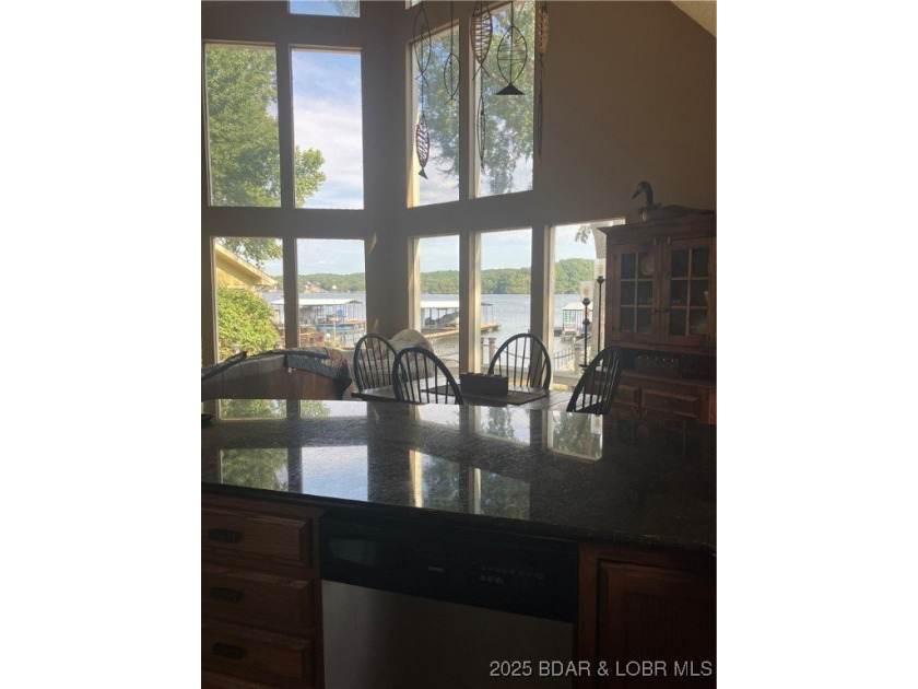 > A wall of windows and vaulted ceilings. Main level living! Big - photo 12