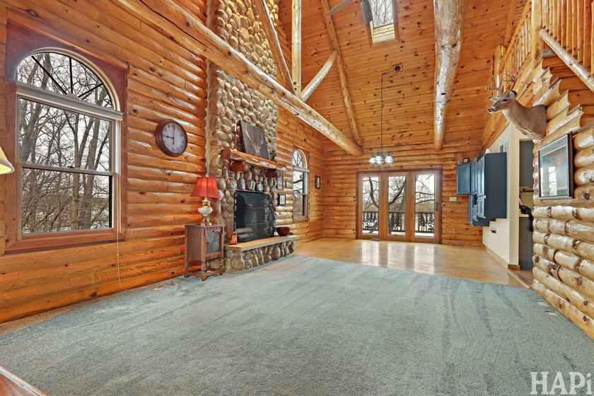 Welcome to this beautiful waterfront log home tucked away on a - photo 2