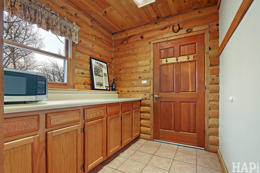 Welcome to this beautiful waterfront log home tucked away on a - photo 7