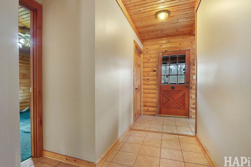 Welcome to this beautiful waterfront log home tucked away on a - photo 8