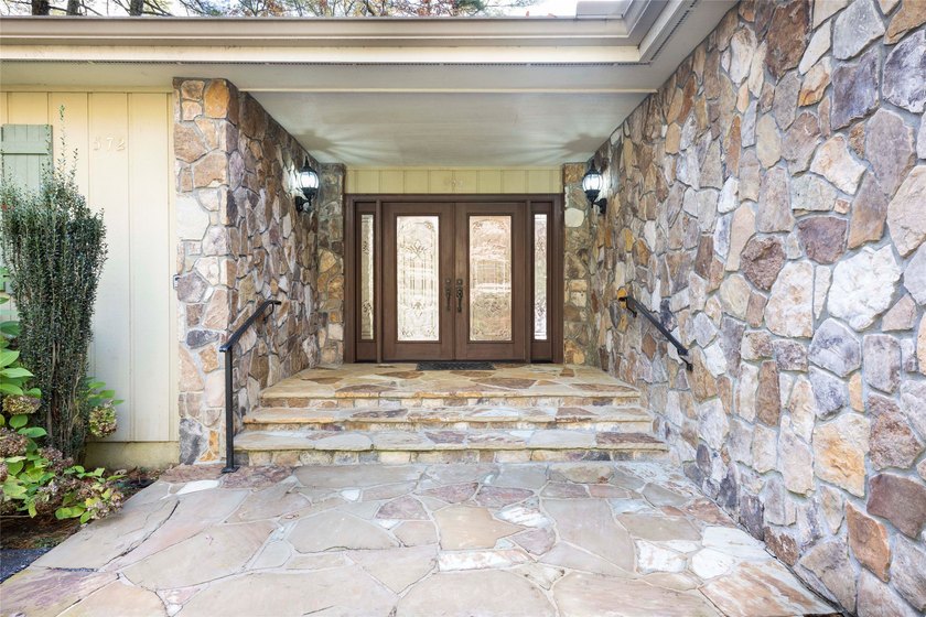 Set along the peaceful shores of Lake Toxaway, this inviting - photo 2