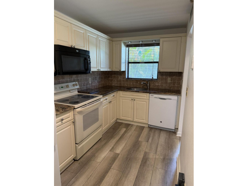 Welcome to this bright 2-bedroom, 2-bathroom condominium nestled - photo 3