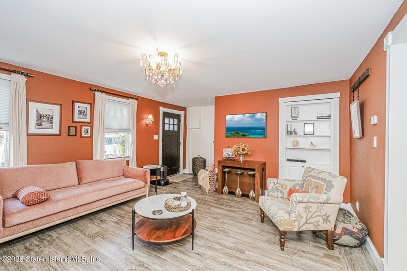 Welcome to this well-maintained three-family home in the highly - photo 3