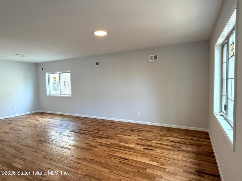 THIS SPACIOUS, DETACHED TWO-FAMILY '7 OVER 7'HOME LOCATED IN THE - photo 2