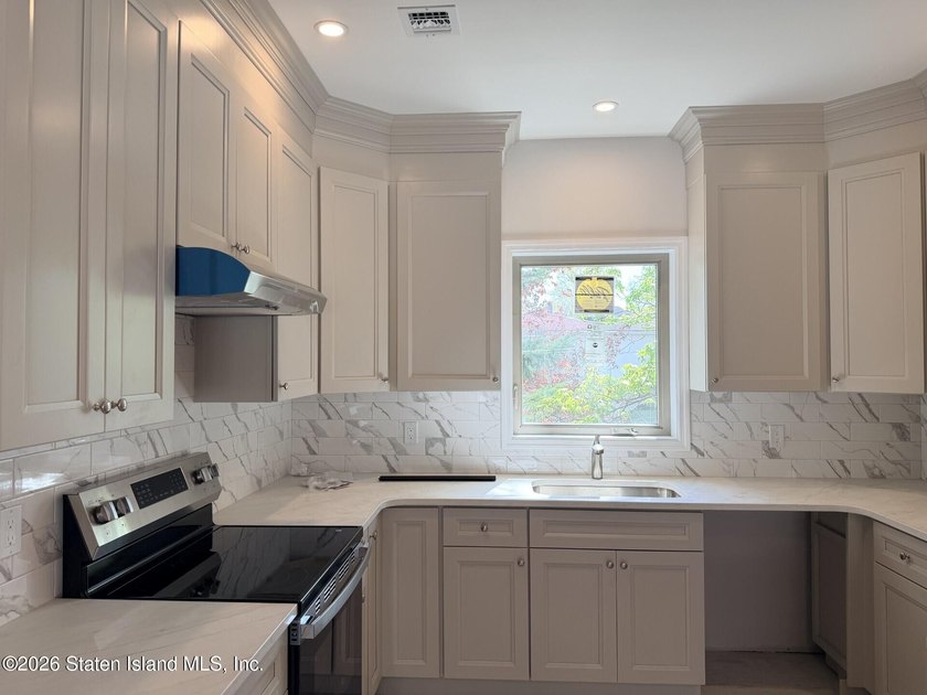 THIS SPACIOUS, DETACHED TWO-FAMILY '7 OVER 7'HOME LOCATED IN THE - photo 10