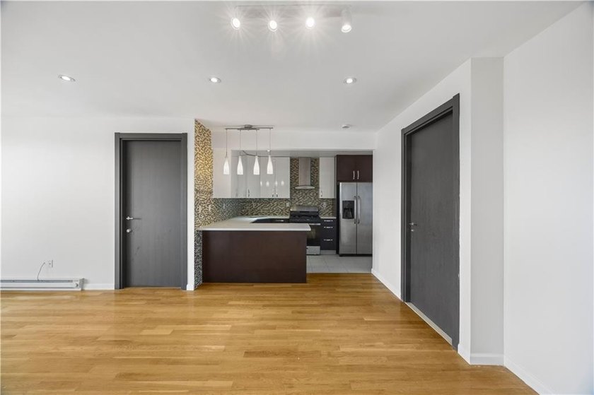Welcome to Residence 6B at 2424 Ocean Avenue, a sun-drenched - photo 3