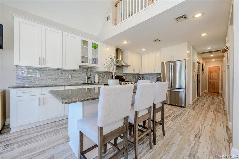 Welcome to this Pristine, Renovated, FEMA-Compliant Coastal - photo 6