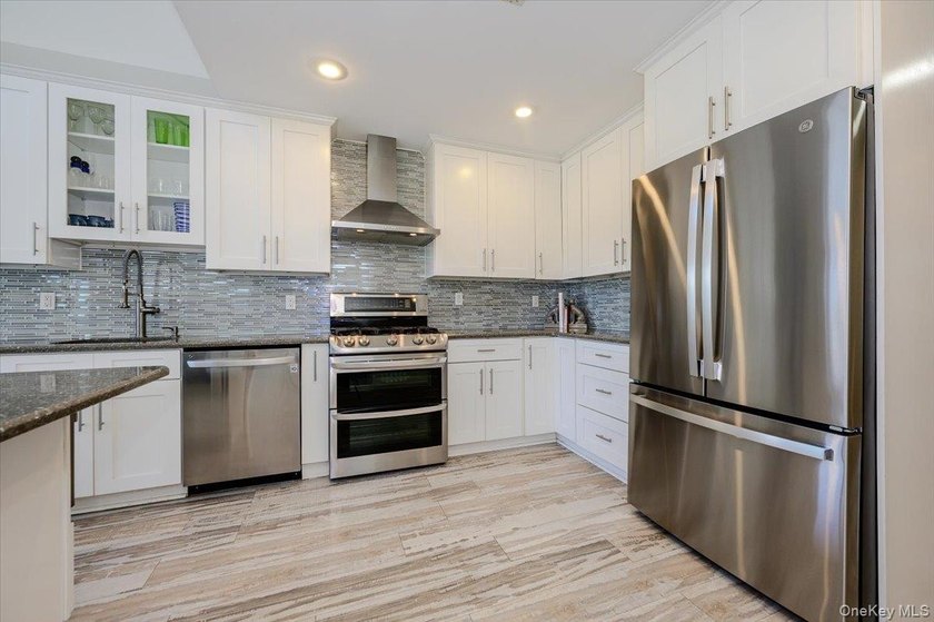 Welcome to this Pristine, Renovated, FEMA-Compliant Coastal - photo 7