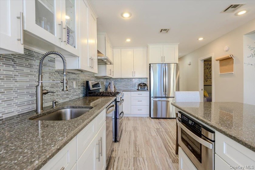 Welcome to this Pristine, Renovated, FEMA-Compliant Coastal - photo 8