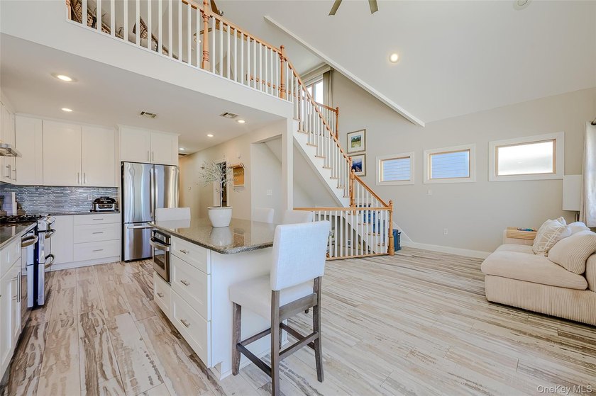 Welcome to this Pristine, Renovated, FEMA-Compliant Coastal - photo 9