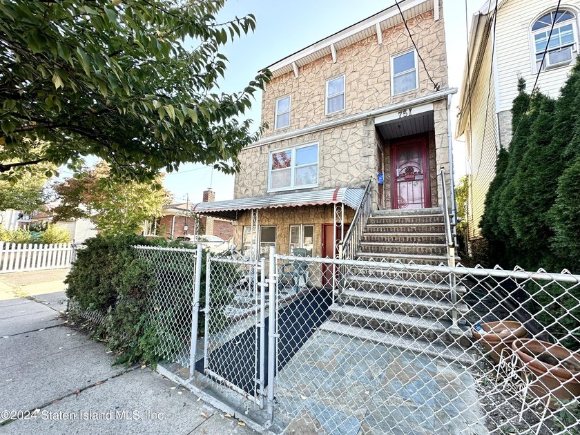 Welcome to this charming two-family detached home located in the - photo 2