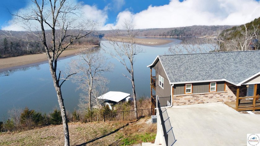 This 3-bedroom, 2.5-bath lakefront home offers over 2,000 square - photo 3