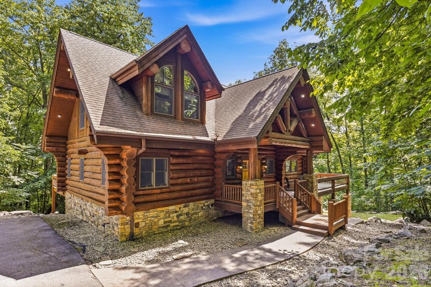 Stunning custom log home nestled on over 3 acres in the shadow - photo 2