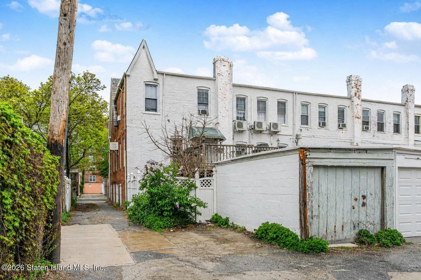 Located at 1879 Haring Street, this full brick end-unit - photo 4