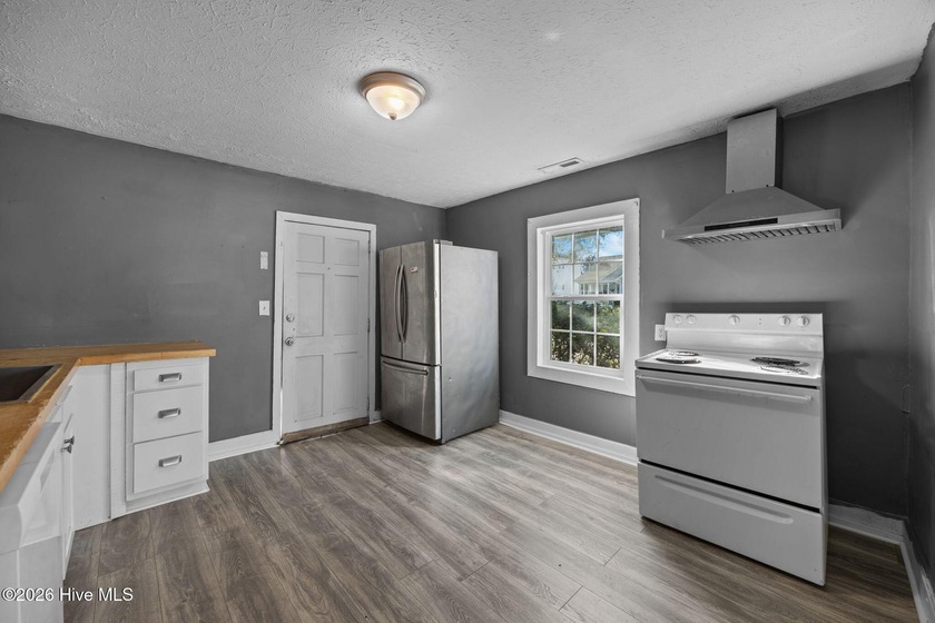 This spacious Carolina Cottage-style home is ideally located in - photo 11