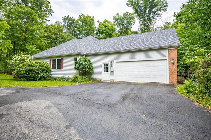 Welcome to this sprawling 2005-built ranch, privately nestled on - photo 31