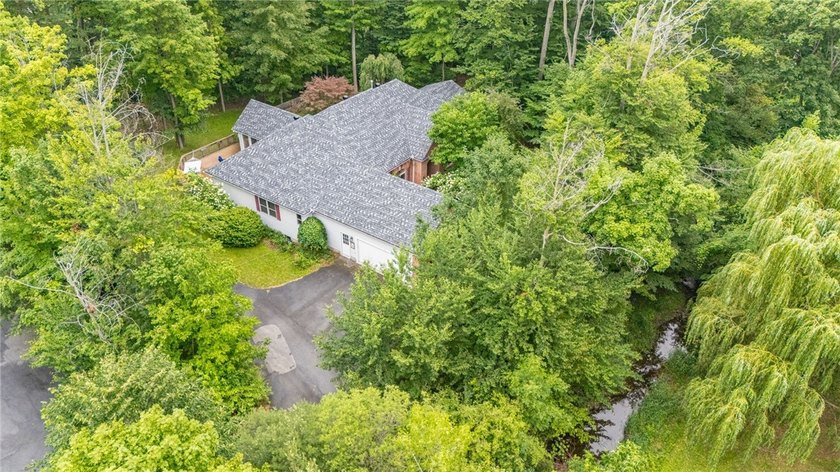 Welcome to this sprawling 2005-built ranch, privately nestled on - photo 36