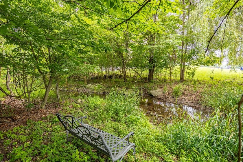 Welcome to this sprawling 2005-built ranch, privately nestled on - photo 39