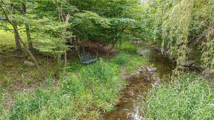 Welcome to this sprawling 2005-built ranch, privately nestled on - photo 40