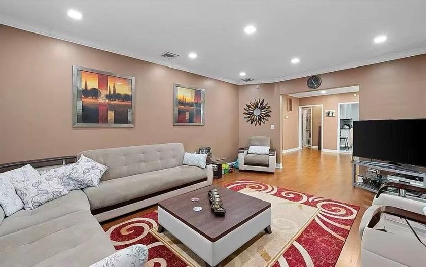 Stunning detached two-family home situated in the highly - photo 2