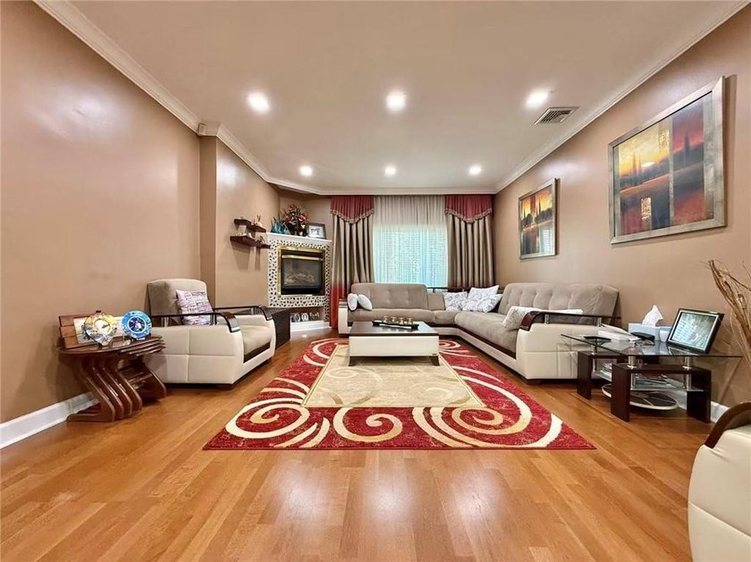 Stunning detached two-family home situated in the highly - photo 4