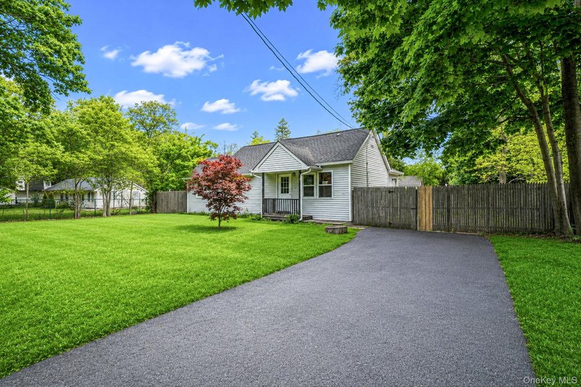 Nestled in the heart of Mastic Beach, 113 Huguenot Drive is the - photo 2