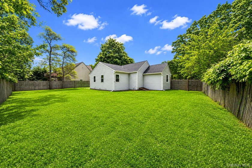 Nestled in the heart of Mastic Beach, 113 Huguenot Drive is the - photo 8