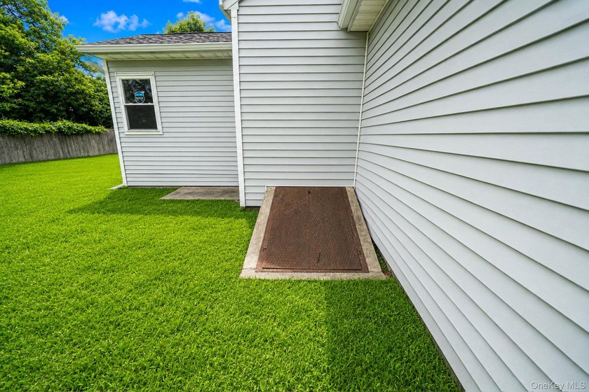 Nestled in the heart of Mastic Beach, 113 Huguenot Drive is the - photo 9