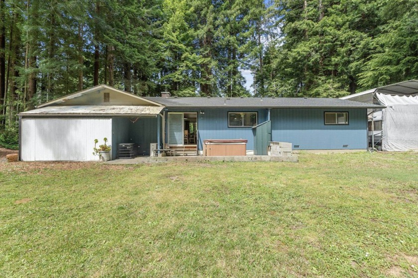 Tucked beneath towering redwoods on a full acre, this 2-bedroom - photo 33