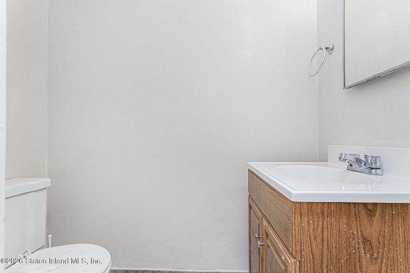 Welcome to 73 Gary Place! This large 2-family, semi-attached - photo 6