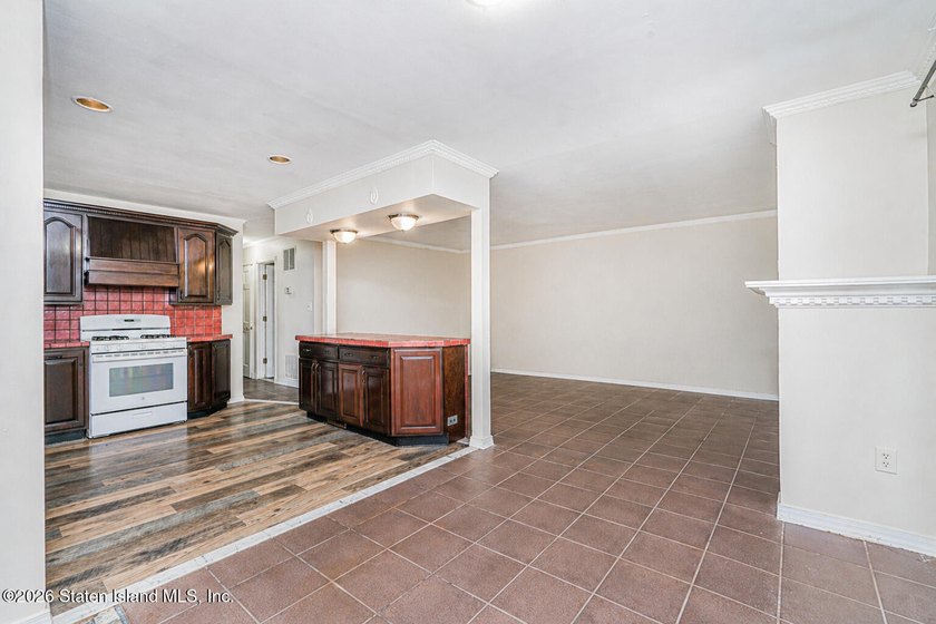 Welcome to 73 Gary Place! This large 2-family, semi-attached - photo 9