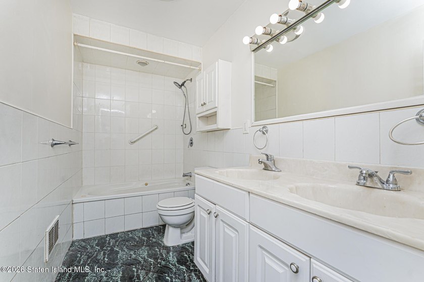Welcome to 73 Gary Place! This large 2-family, semi-attached - photo 10