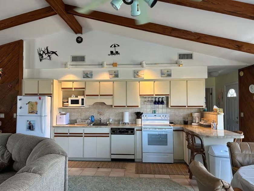 Step back to a simpler time in this charming coastal retreat - photo 8