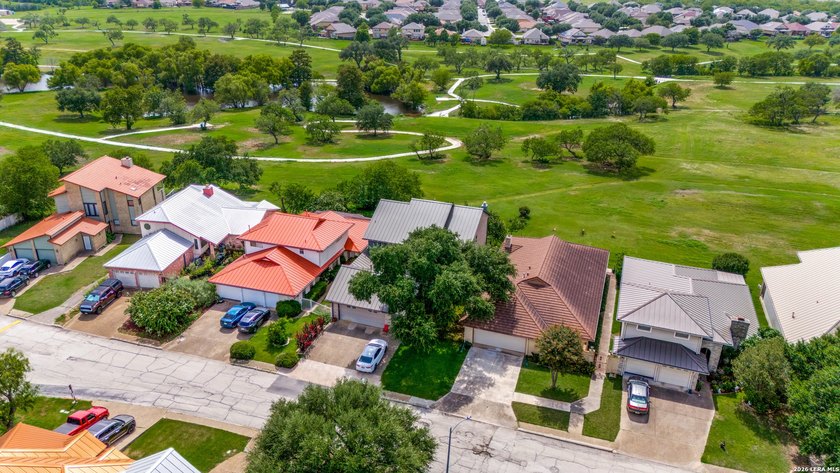 Rare custom home backing directly to a scenic city park with - photo 2