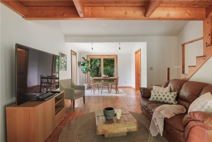 Beautiful contemporary home tucked into the woods with a creek - photo 13