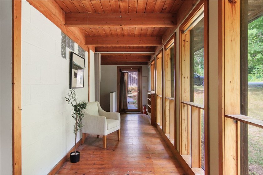 Beautiful contemporary home tucked into the woods with a creek - photo 14