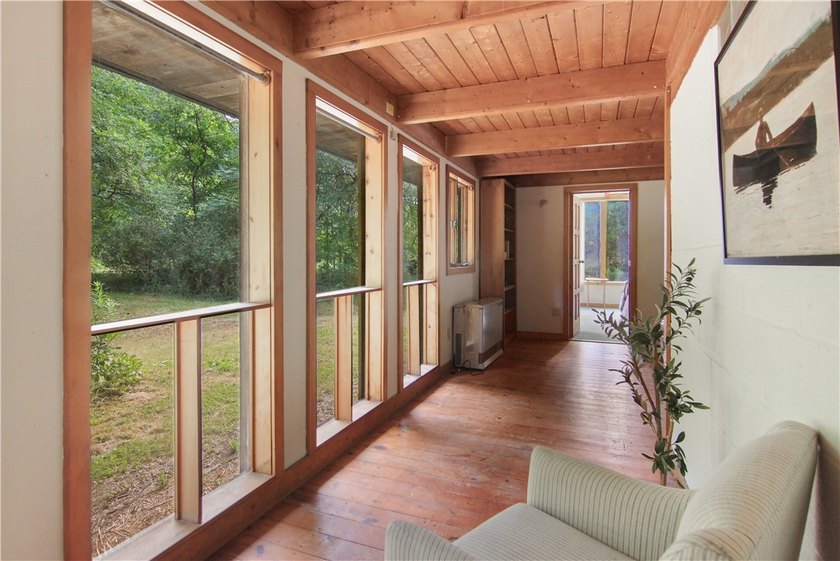 Beautiful contemporary home tucked into the woods with a creek - photo 15