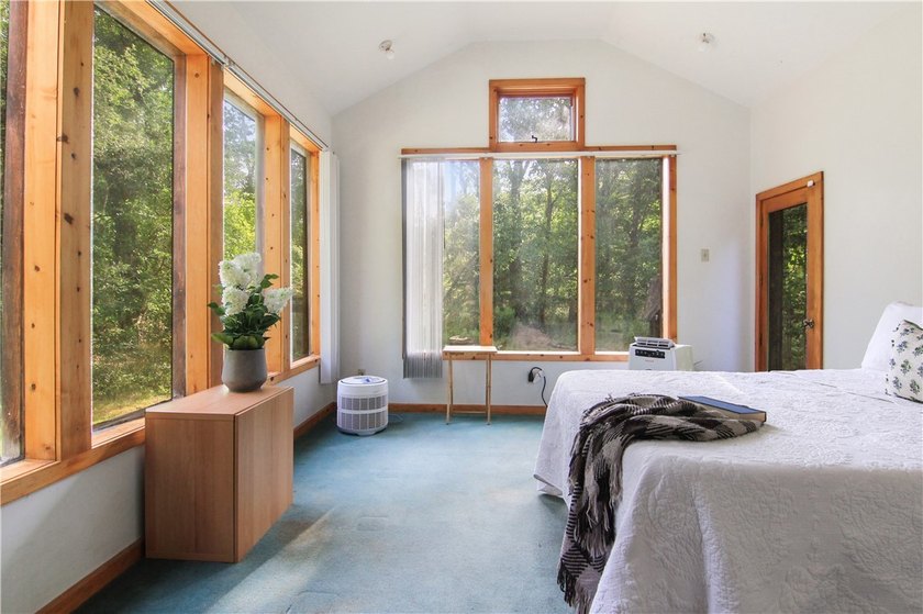 Beautiful contemporary home tucked into the woods with a creek - photo 16