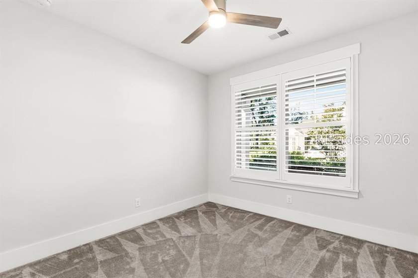 Tucked away on a private, wooded lot, this stunning single-story - photo 11