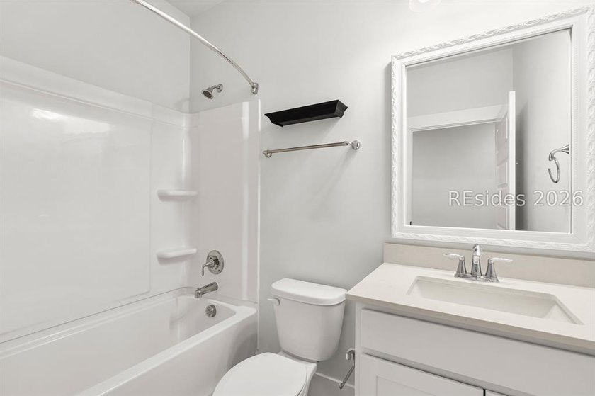 Tucked away on a private, wooded lot, this stunning single-story - photo 14