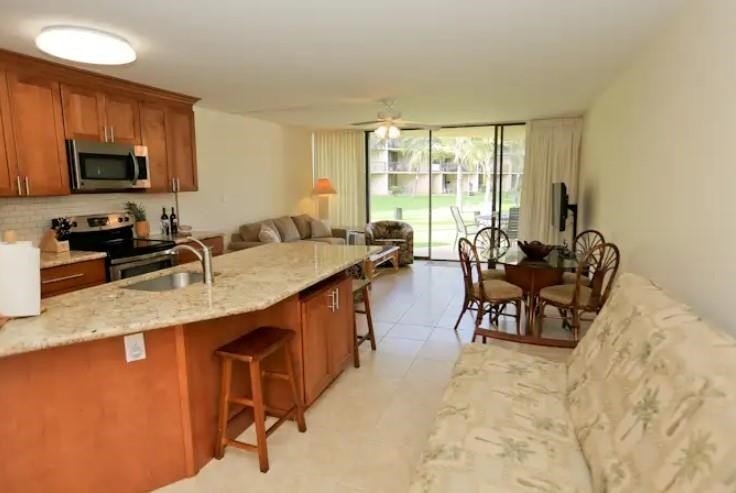 This beautifully updated 1 bedroom, 2 bathroom condo is ground - photo 14
