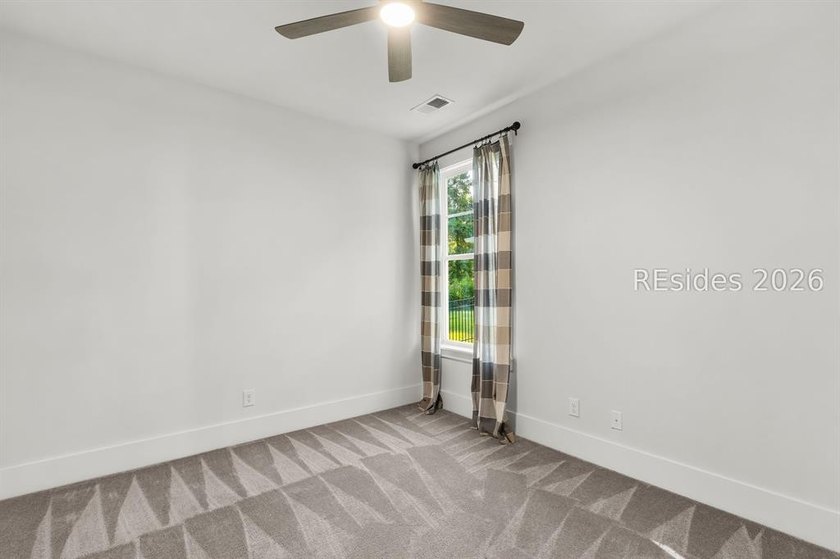Tucked away on a private, wooded lot, this stunning single-story - photo 15
