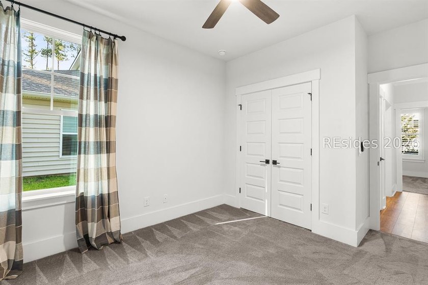 Tucked away on a private, wooded lot, this stunning single-story - photo 16