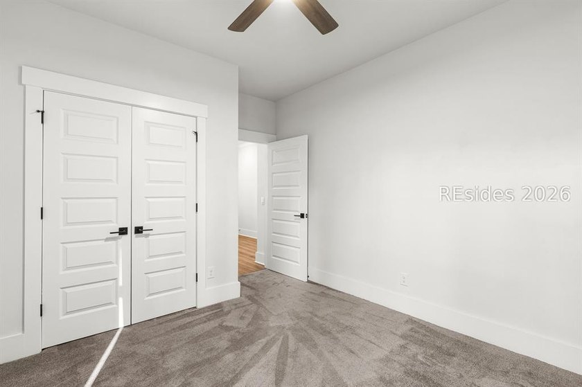 Tucked away on a private, wooded lot, this stunning single-story - photo 17