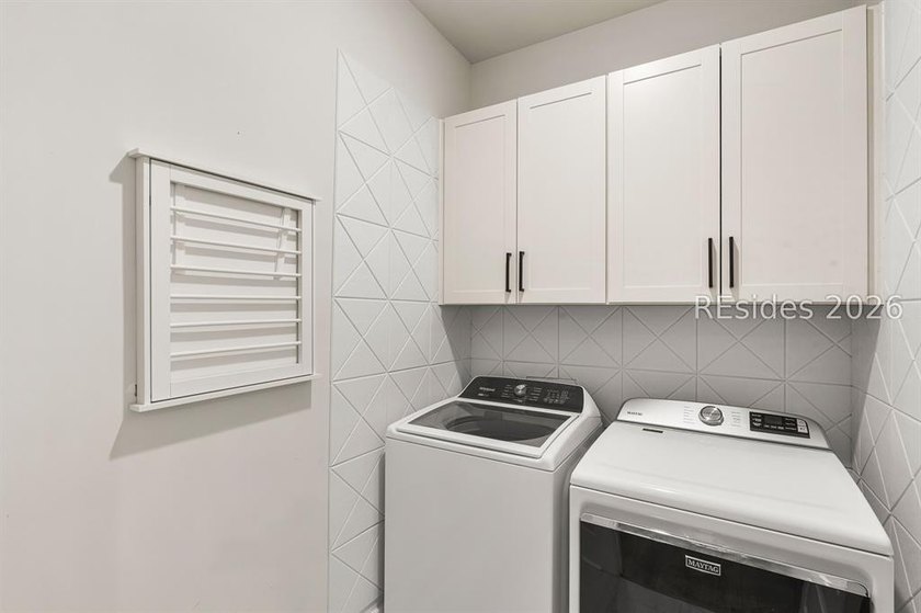 Tucked away on a private, wooded lot, this stunning single-story - photo 18