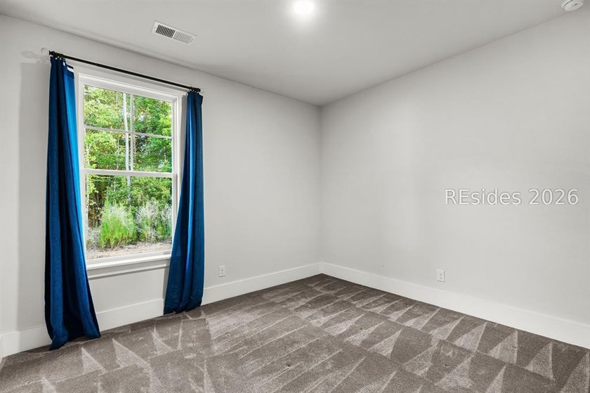 Tucked away on a private, wooded lot, this stunning single-story - photo 20
