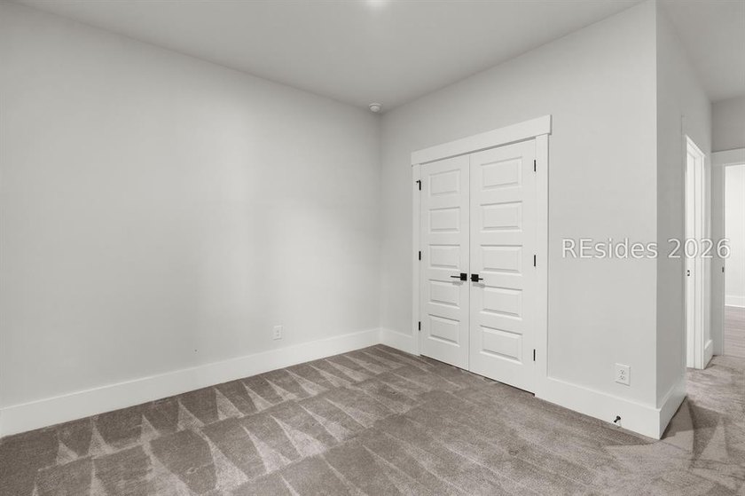 Tucked away on a private, wooded lot, this stunning single-story - photo 21