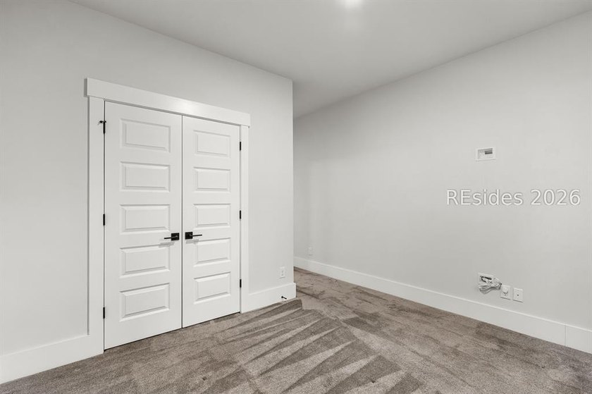Tucked away on a private, wooded lot, this stunning single-story - photo 22