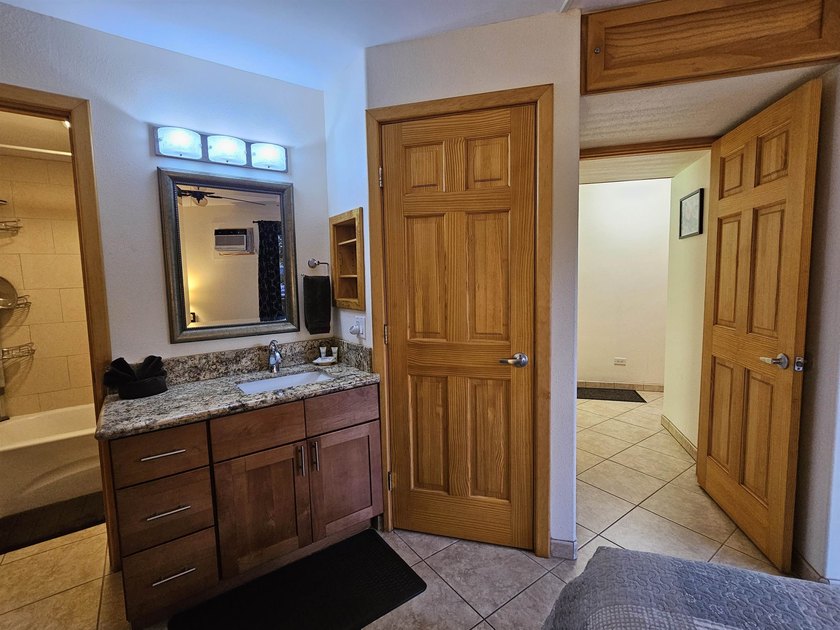 This beautifully updated 1 bedroom, 2 bathroom condo is ground - photo 34